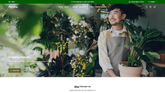 Florists website homepage with images of plants and a person holding a plant.